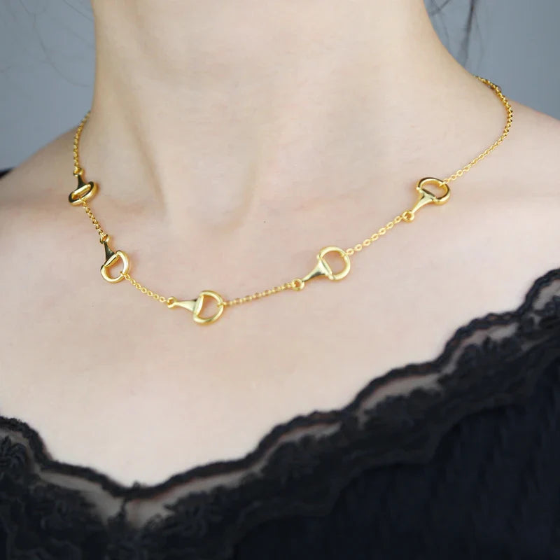 Gold snaffle bit necklace