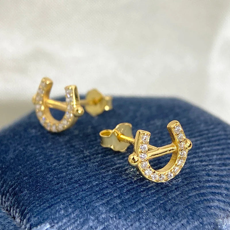 Gold horse shoe earrings