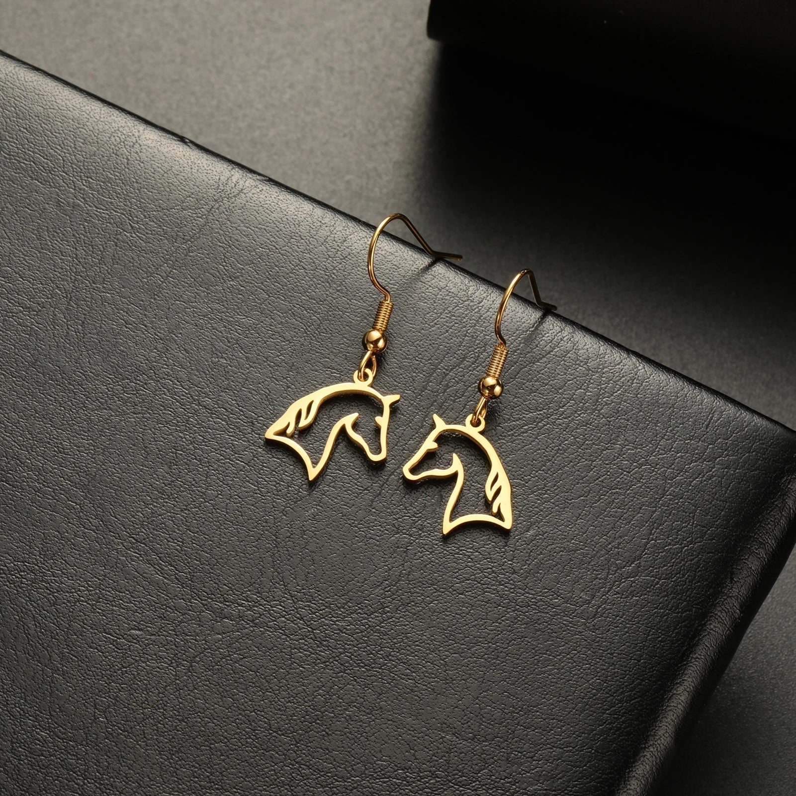 Gold horse head earrings