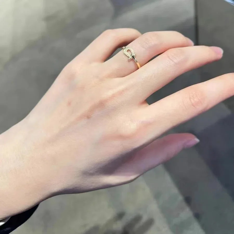 Ring with horseshoe